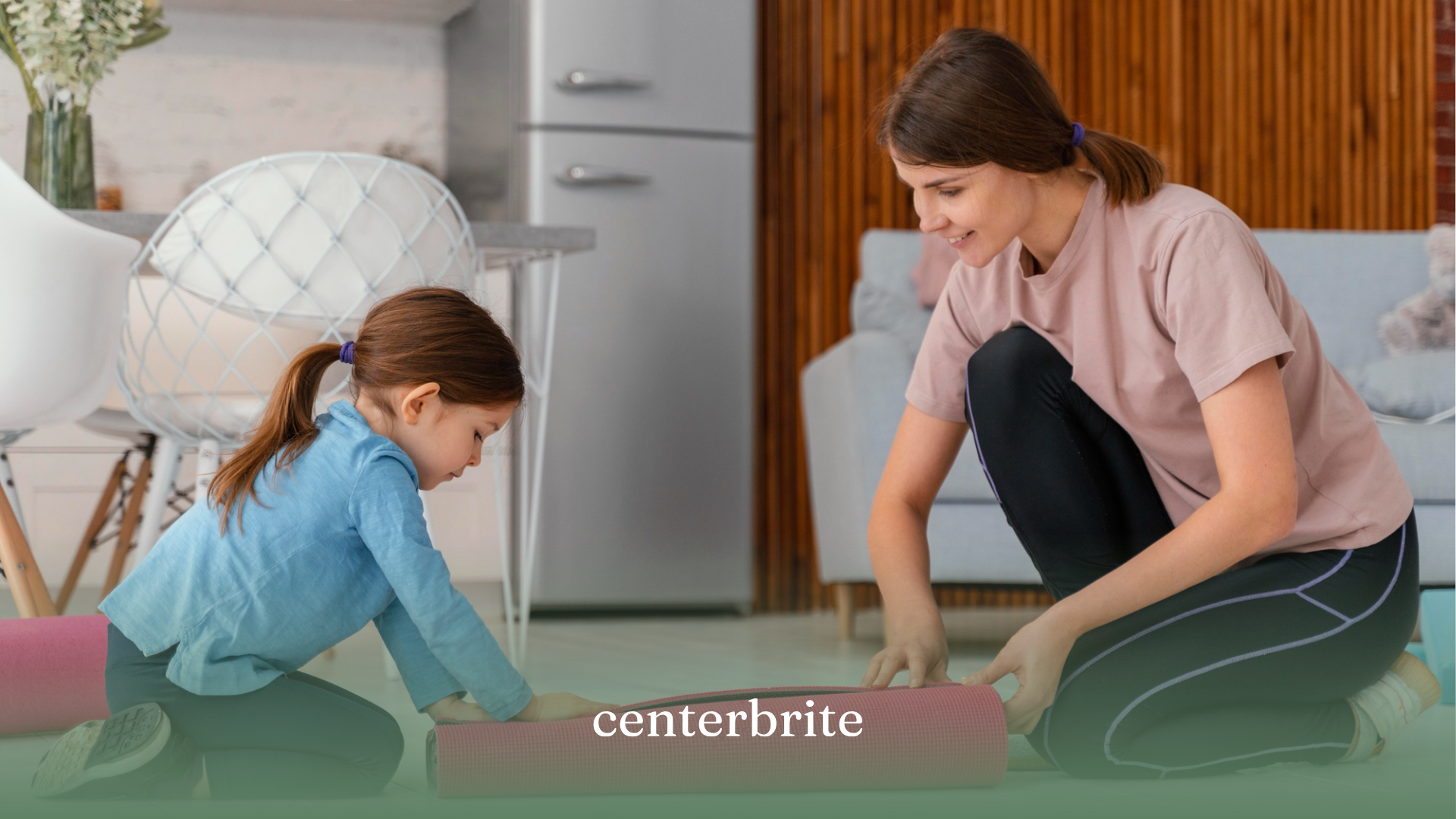 A kid helping her mom roll a mat, preparing their home for in-home ABA therapy